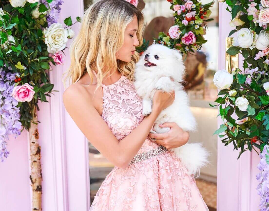 Model wearing a pink prom dress